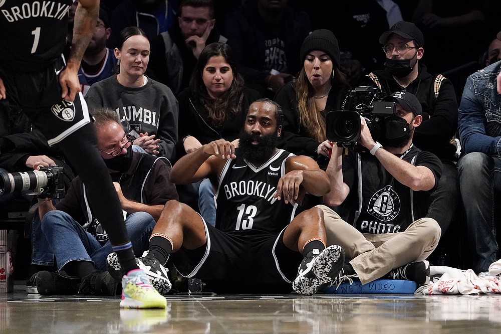 Brooklyn Nets guard James Harden (13) drops to the baseline in response to referee calls during the second half of an NBA basketball game against the Charlotte Hornets, Sunday, Oct. 24, 2021, in New York. (AP Photo/John Minchillo)