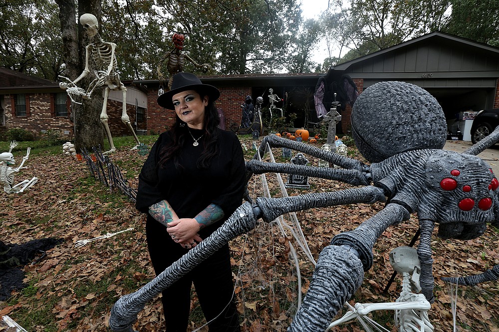 “Hallowqueen” Valerie Hitchcock and her family’s love of the holiday is obvious by the display at their home. (Arkansas Democrat-Gazette/Thomas Metthe)