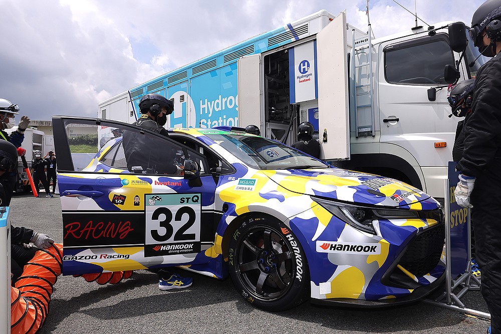 This photo released by Toyota Motor Corp., shows a hydrogen engine car being refueled during the five-hour-long Super Taikyu Race at Autopolis in Hita, Oita prefecture, southern Japan on July 31, 2021. Toyota said Monday, Oct. 25, 2021 it is testing hydrogen combustion engines in race cars as it works toward using the technology in commercial products. (Toyota Motor Corp. via AP)