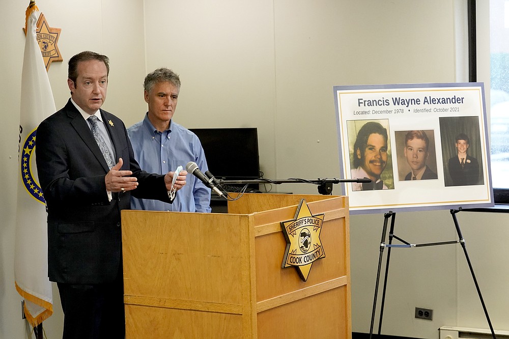 Cook County Sheriff's Detective Lt. Jason Moran, left, responds to a question with Sheriff Tom Dart after Dart announced the identity of "Gacy Victim 5" as North Carolina native Francis Wayne Alexander during a news conference Monday, Oct. 25, 2021, in Maywood, Ill. Alexander's body was among 26 discovered by police in the crawl space of John Wayne Gacy's home more than 40 years ago, with three more found outside the house and four others found in waterways that Gacy admitted killing. Police were able to identify 25 of the victims but the final eight, Alexander among them, were buried without having ever been identified. (AP Photo/Charles Rex Arbogast)