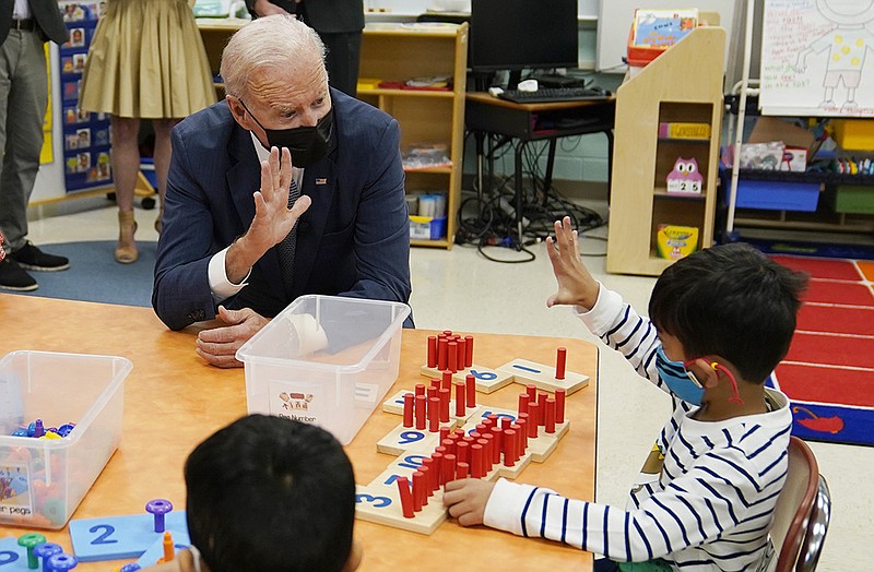 President Joe Biden talks to students during a visit to East End Elementary School to promote his &quot;Build Back Better&quot; agenda, Monday, Oct. 25, 2021, in North Plainfield, N.J. (AP Photo/Evan Vucci)