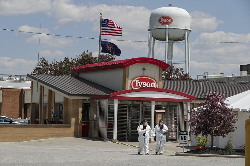 FILE - In this May 7, 2020 file photo, workers leave the Tyson Foods pork processing plant in Logansport, Ind. Meatpacking giant Tyson Foods says more than 96% of its workers have been vaccinated ahead of a Nov. 1 deadline for them to do so. The Springdale, Ark., based company said the number of its 120,000 workers who have been vaccinated has nearly doubled since it announced its mandate on Aug. 3. At that point, only 50% of Tyson workers had been vaccinated. (AP Photo/Michael Conroy, File)