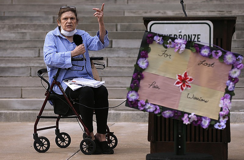 Jo Ellen Stodola sits in her walker while telling her story of chronic pain issues during the Don't Punish Pain Rally on Tuesday, Oct. 26, 2021, at the state Capitol in Little Rock. 
(Arkansas Democrat-Gazette/Thomas Metthe)