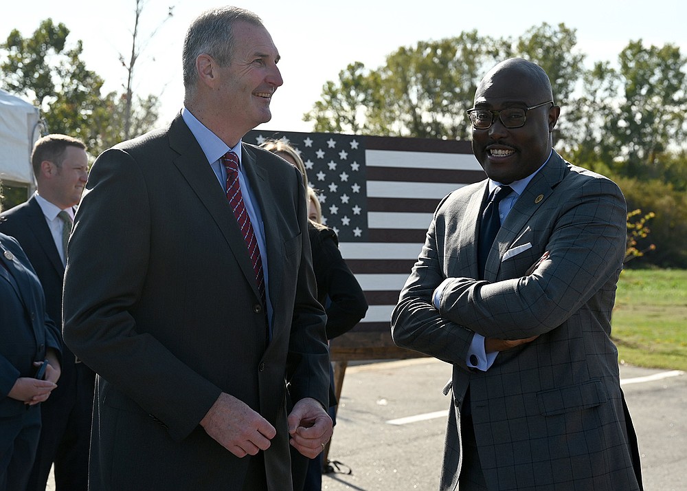 Trex CEO Bryan Fairbanks, left, talks with Mayor Frank Scott, Jr. before the start of an announcement that Trex Co., Inc. A maker of Decking, railing, and outdoor items made from recycled materials, plans to build a factory in the Port of Little Rock on Tuesday, Oct. 26, 2021. The new factory will bring 500 jobs to the area over the next five years. See more photos at arkansasonline.com/1027port/

(Arkansas Democrat-Gazette/Stephen Swofford)