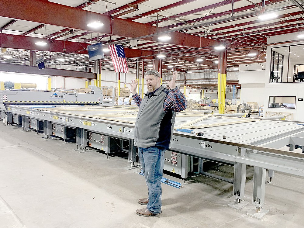 LYNN KUTTER ENTERPRISE-LEADER 
Mike Sims, operations manager of Summit Structural Systems in Lincoln, gives a tour of the plant. Summit produces trusses for construction projects.