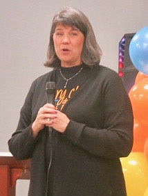 Westside Eagle Observer/SUSAN HOLLAND
Maribel Childress, superintendent of Gravette schools, welcomes guests at the Gravette Bright Futures fifth anniversary celebration. Childress told a little about the programs and initiatives of the organization which seeks to meet all needs of Gravette students.