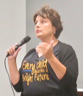 Westside Eagle Observer/SUSAN HOLLAND
Heather Finley, president of Gravette Bright Futures, recounts some of the experiences she has had while serving with the organization. She outlined some of the needs of area children and urged all those attending the group's anniversary celebration to get involved and help meet those needs.