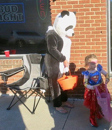 Westside Eagle Observer/SUSAN HOLLAND
A friendly panda bear hands out candy at The Recreation Parlor. The Recreation Parlor, one of Gravette's newest businesses, hosted a costume contest Saturday evening after Trick or Treat on Main Street.