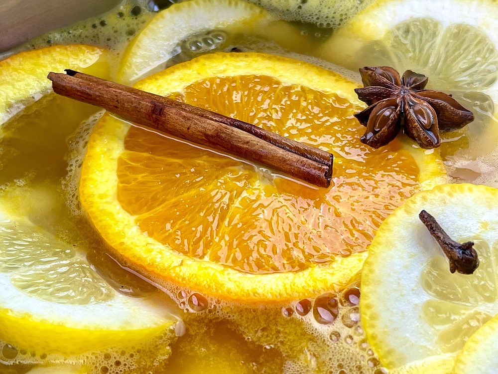 Weisser Gluhwein (mulled white wine) is simmered with orange, lemon, cinnamon, star anise and cloves. (Arkansas Democrat-Gazette/Kelly Brant)
