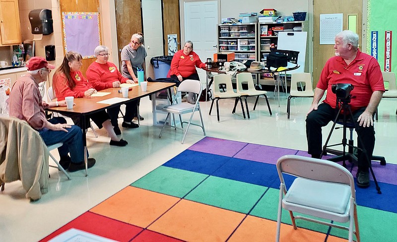 Photo by Jeff Davis
Members of the Gravette Lions Club visit with school nurse Wendy Catron (standing) while preparing to do eye testing of students at Glenn Duffy Elementary School last month. Club members tested 178 pre-K and kindergarten students on Oct. 20 and 21 and referred several for further treatment. Pictured are Lions Don Dunn, Linda Damron, Sue Rice, Snooky Garrett and Al Blair (seated behind eye testing machine).