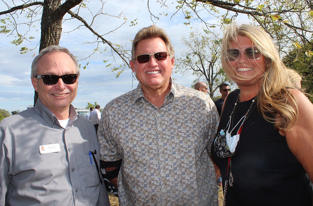 Patrick Tenney (L to R), Bryan Hunt and Mandy Macke attend the Children's Safety Center Announcement Celebration. (NWA Democrat-Gazette / Carin Schoppmeyer)