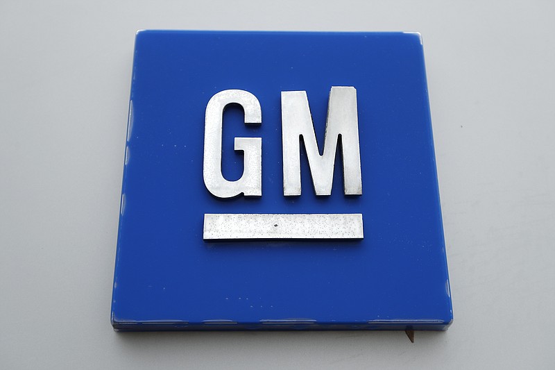 This Jan. 27, 2020 photo shows the General Motors logo. High prices for trucks and SUVs helped General Motors post a $2.4 billion third-quarter profit despite factory closures due to a shortage of computer chips and other parts. But the profit was 40% lower than the $4 billion GM made during the same period last year as sales slumped last quarter and the company lost market share in the U.S., its most profitable country. (AP Photo/Paul Sancya)