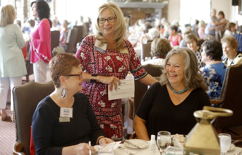 NWA Democrat-Gazette/DAVID GOTTSCHALK Dee Vaughn (center) visits with Kathy McClure (left) and Connie Gayer (right), Tuesday, July 24, 2018, at the beginning of the Circle of Life Hospice&#x201a;&#xc4;&#xf4;s Ladies Auxiliary luncheon at Pinnacle Country Club in Rogers. The auxiliary advocates for people to use hospice benefits, helps raise money and grants peoples&#x201a;&#xc4;&#xf4; last wishes before death when possible.