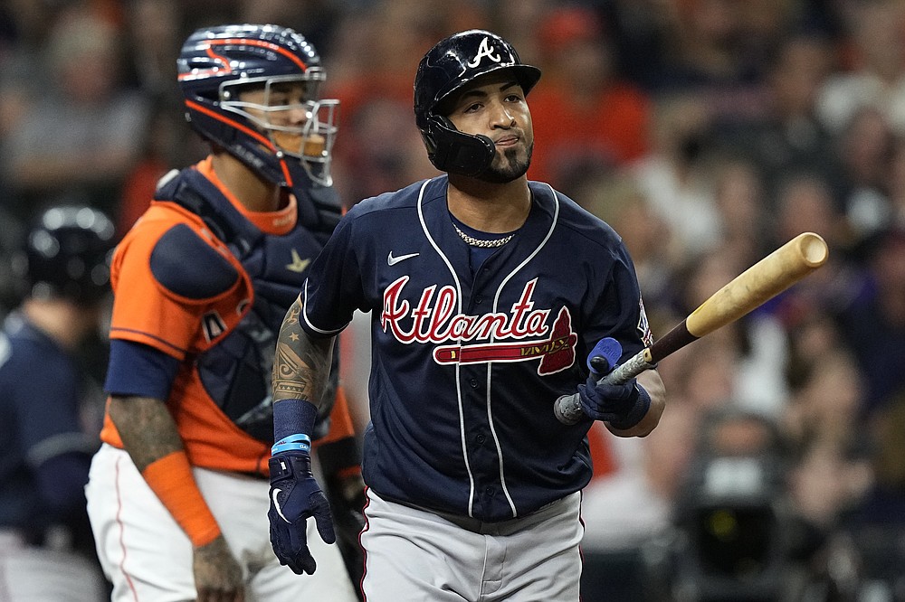 Atlanta Braves' Eddie Rosario flies out during the seventh inning in Game 2 of baseball's World Series between the Houston Astros and the Atlanta Braves Wednesday, Oct. 27, 2021, in Houston. (AP Photo/David J. Phillip)