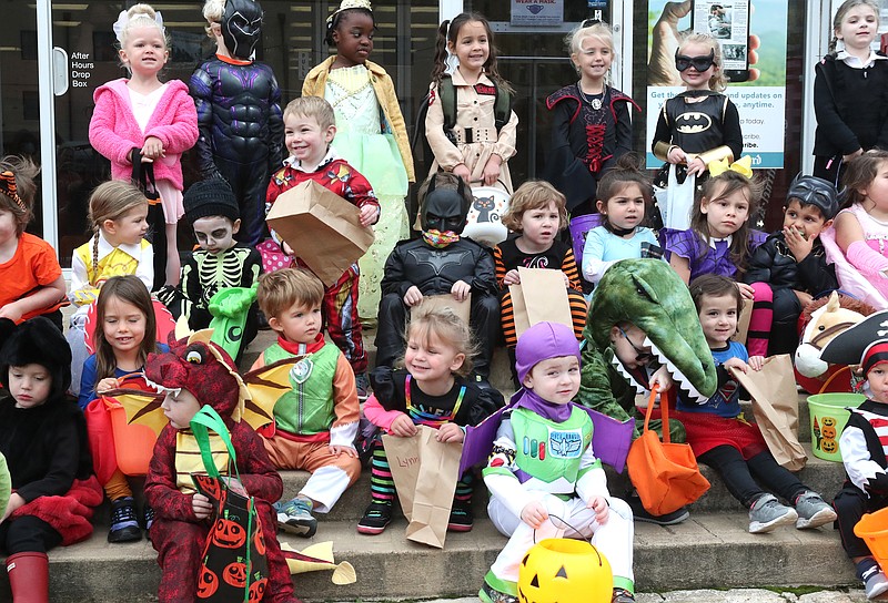 St. Luke’s Episcopal Day School gather on the front steps of The Sentinel-Record in their costumes for a group photograph. - Photo by Richard Rasmussen of The Sentinel-Record