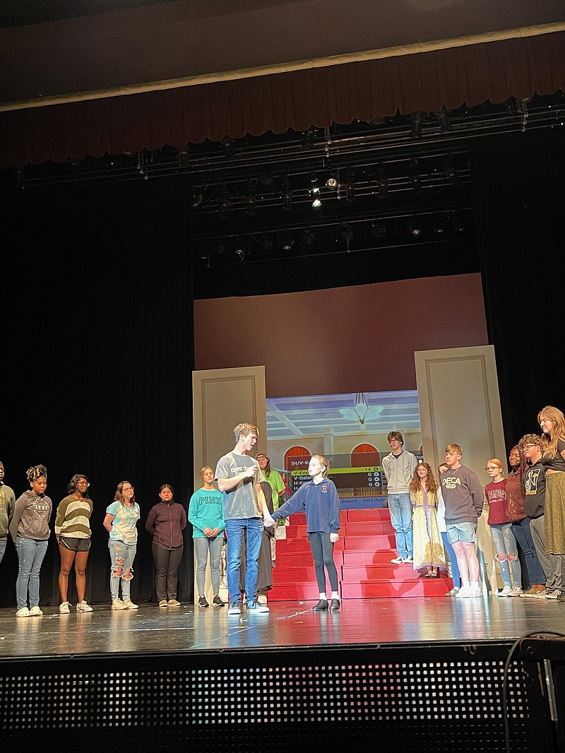 Jeremy Creek, Alexis Mayo and other cast members rehearse for “Annie.” (Submitted photos.)