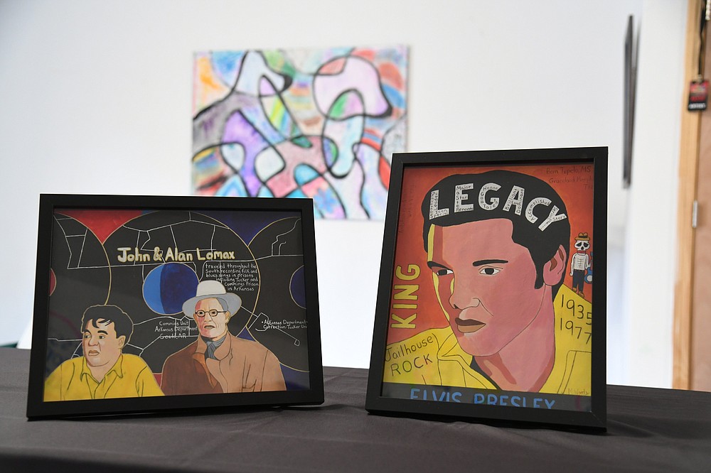 Art by Markeith Woods, front, and a painting by Carrie Gaston and around eight C4K students, will be for sale at the annual The Birth of an Artist show on Nov. 13. - Photo by Tanner Newton of The Sentinel-Record