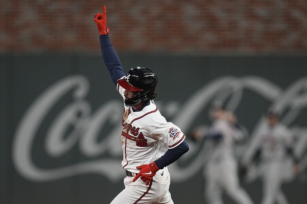 Atlanta Braves' Dansby Swanson celebrates his home run during the seventh inning in Game 4 of baseball's World Series between the Houston Astros and the Atlanta Braves Saturday, Oct. 30, 2021, in Atlanta. (AP Photo/Ashley Landis)