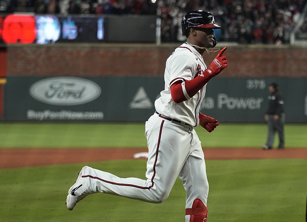 Atlanta Braves' Jorge Soler celebrates a home run during the seventh inning in Game 4 of baseball's World Series between the Houston Astros and the Atlanta Braves Saturday, Oct. 30, 2021, in Atlanta.(AP Photo/Ashley Landis)