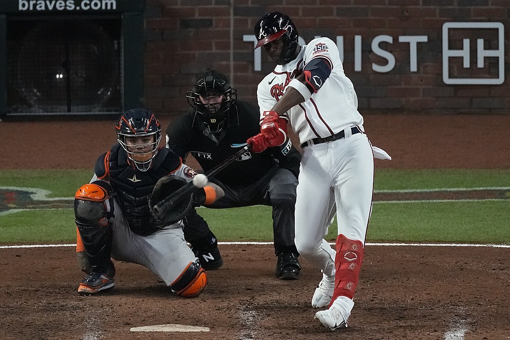 Atlanta Braves' Jorge Soler hits a home run during the seventh inning in Game 4 of baseball's World Series between the Houston Astros and the Atlanta Braves Saturday, Oct. 30, 2021, in Atlanta. (AP Photo/John Bazemore)