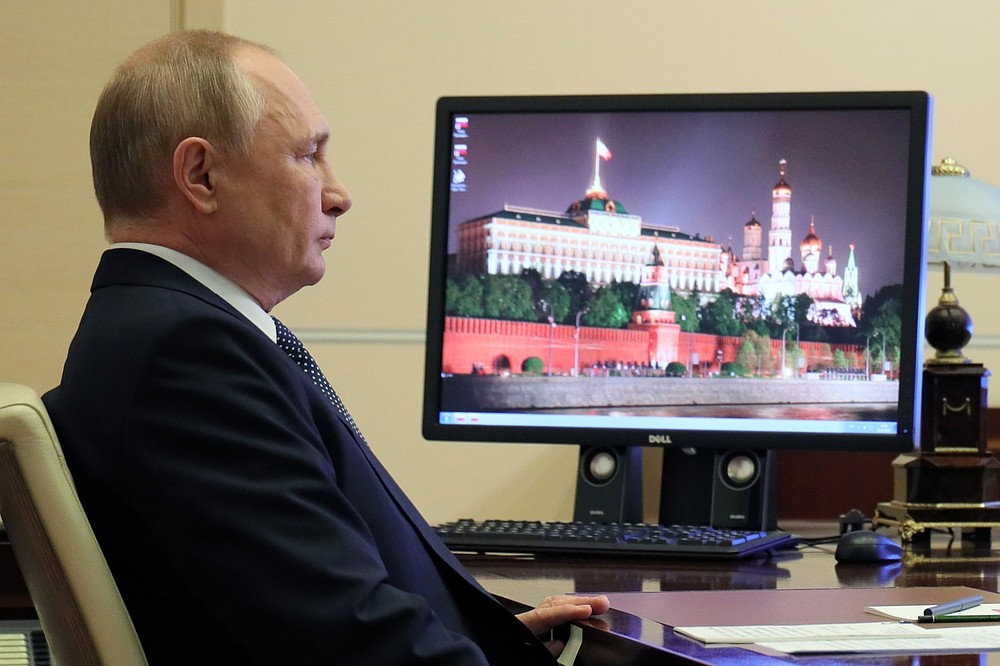 Russian President Vladimir Putin attends the G20 summit via videoconference at the Novo-Ogaryovo residence outside Moscow, Russia, Sunday, Oct. 31, 2021. The two-day Group of 20 summit is the first in-person gathering of leaders of the world's biggest economies since the COVID-19 pandemic started. (Evgeniy Paulin, Sputnik, Kremlin Pool Photo via AP)