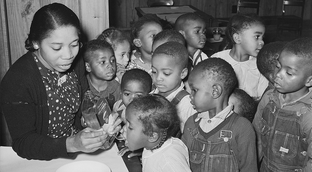 It was time for cod liver oil in the nursery school when Farm Security Administration photographer Russell Werner Lee (1903-1986) visited the Lakeview Resettlement Project, 15 miles southwest of Helena, in December 1938.
(Library of Congress Prints &amp;amp; Photographs Division)