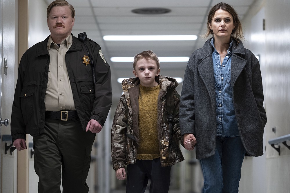 This image released by Searchlight Pictures shows Jesse Plemmons, from left, Jeremy T. Thomas and Keri Russell in a scene from &quot;Antlers.&quot; (Kimberly French/Searchlight Pictures via AP)