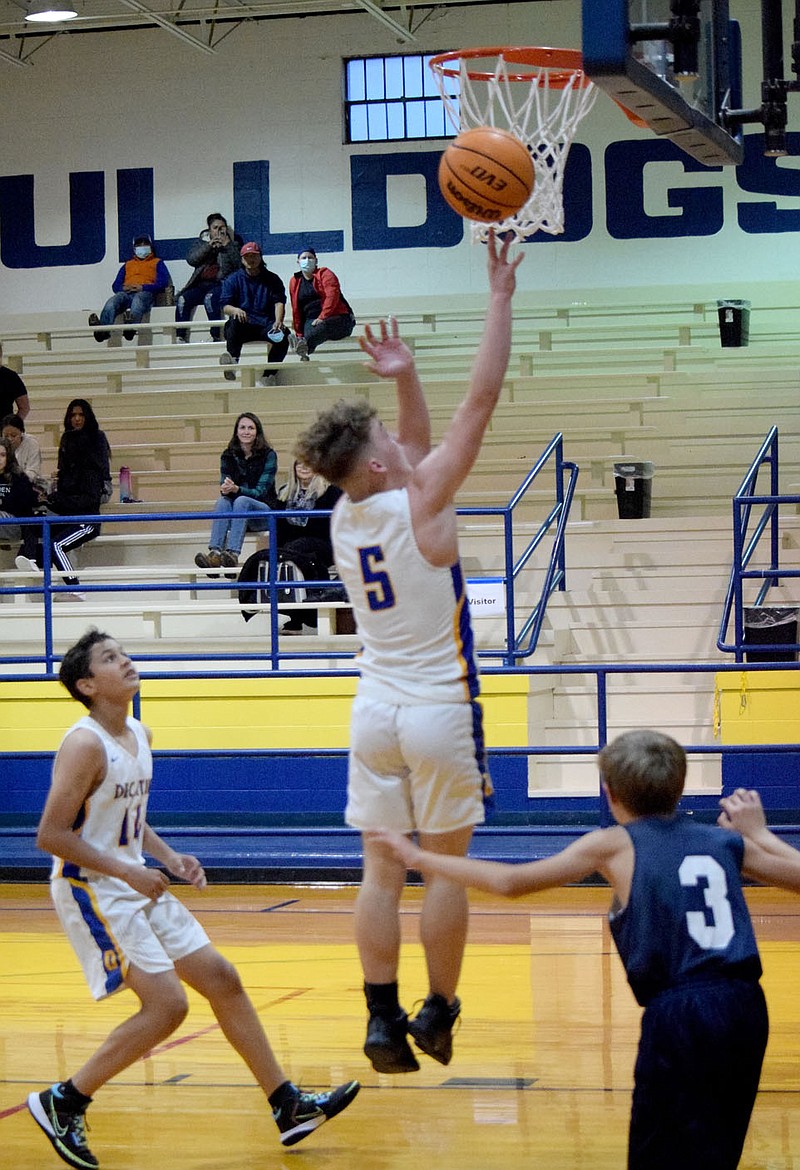 Westside Eagle Observer/MIKE ECKELS
Bulldog Jackson Montano (5) puts up a jumper late in the third quarter of the Decatur-Thaden junior high basketball contest at Peterson Gym in Decatur Nov. 1.  Montano led the Bulldogs with eight points which contributed to a 30-11 victory over the Barnstormers.