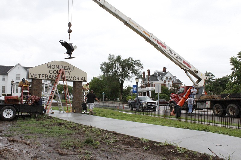 File
Elements of the entryway arch at Latham Memorial Family Park's veterans memorial were set into place in late June this year. Veterans Bob Staton and Ron Harlan have helped lead the way in planning and constructing the memorial, which remains in progress.