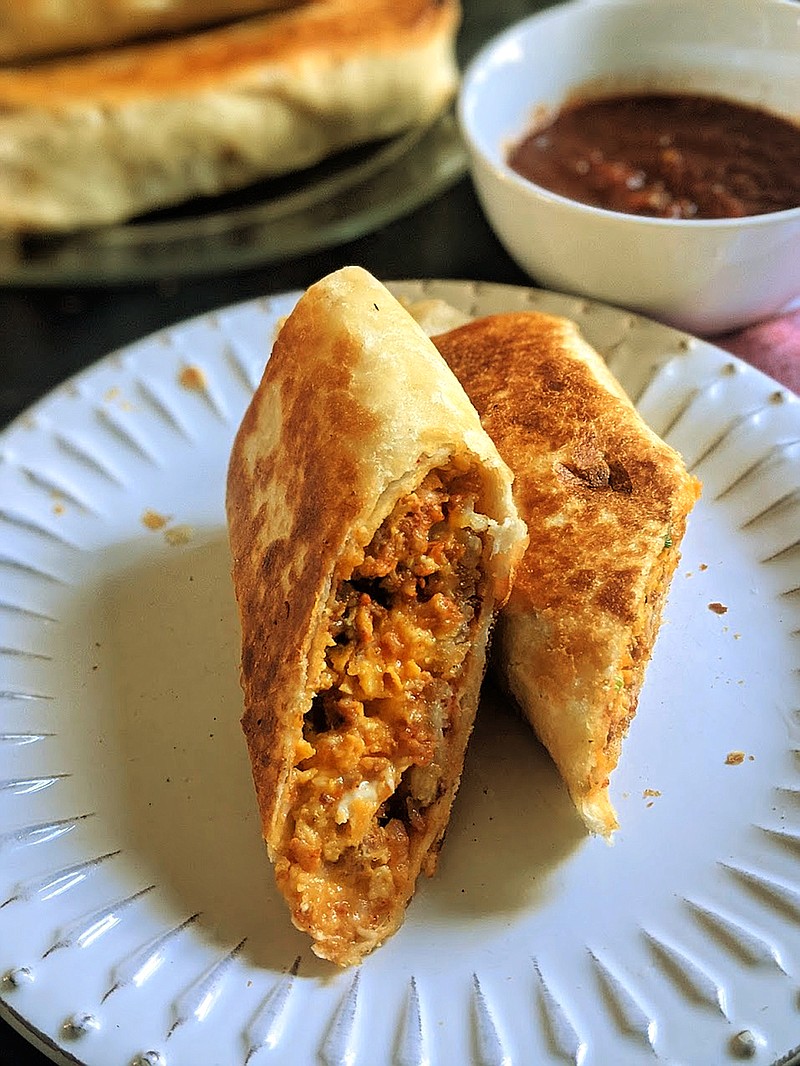 A flour tortilla stuffed with chorizo sausage, scrambled eggs, crispy potatoes and Mexican cheese makes the perfect breakfast-on-the-go. (Gretchen McKay/Pittsburgh Post-Gazette/TNS)