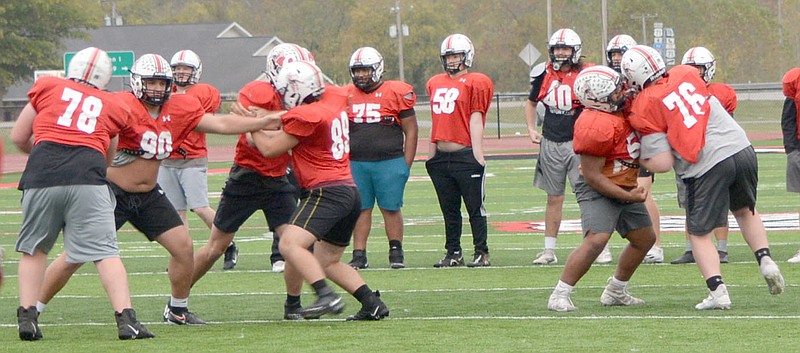 Al Gaspeny/Special to McDonald County Press
McDonald County linemen work during practice Monday at Mustang Stadium. The Mustangs have won seven in a row, and dominant line play on both sides of the ball has been key to that success.