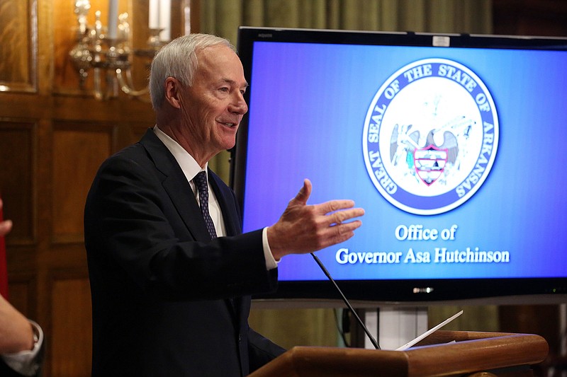 Gov. Asa Hutchinson answers questions during the weekly COVID-19 update on Tuesday, Nov. 2, at the state Capitol in Little Rock. (Arkansas Democrat-Gazette/Thomas Metthe)