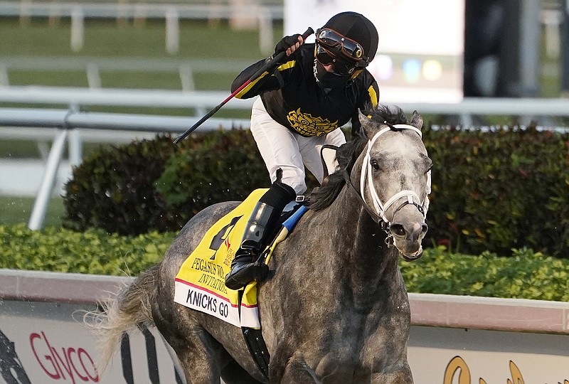 Joel Rosario celebrates atop Knicks Go after the pair won the Pegasus World Cup Invitational on Jan. 23 at Gulfstream Park in Hallandale Beach, Fla. Knicks Go is the 5-2 favorite for this weekend's Breeders' Cup Classic at Del Mar. - Photo by Marta Lavandier of The Associated Press