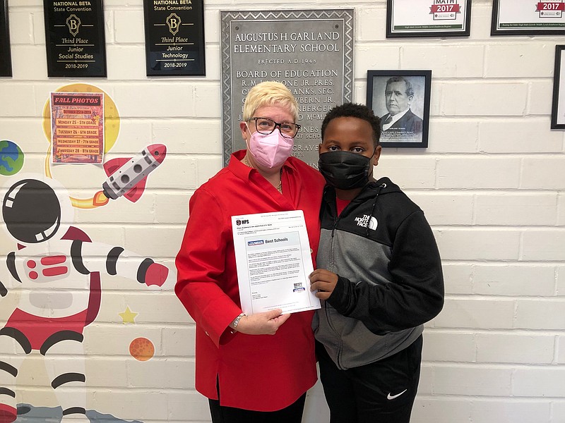 Hope Academy of Public Service Principal Dr. Carol Ann Duke, left, and student JyKhaden Muldrow
display the letter from U.S. News & World Report magazine notifying HAPS of its ranking as a U.S.
News Best Middle School in Arkansas. (Courtesy of Ken McLemore/Hope Public Schools)