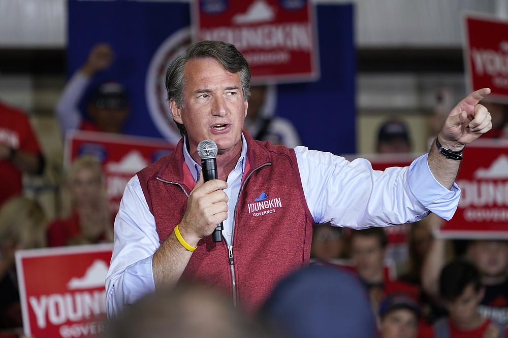 Republican gubernatorial candidate Glenn Youngkin gestures as he speaks to supporters during a rally in Chesterfield, Va., Monday, Nov. 1, 2021. Youngkin will face Democrat former Gov. Terry McAuliffe in the November election. (AP Photo/Steve Helber)