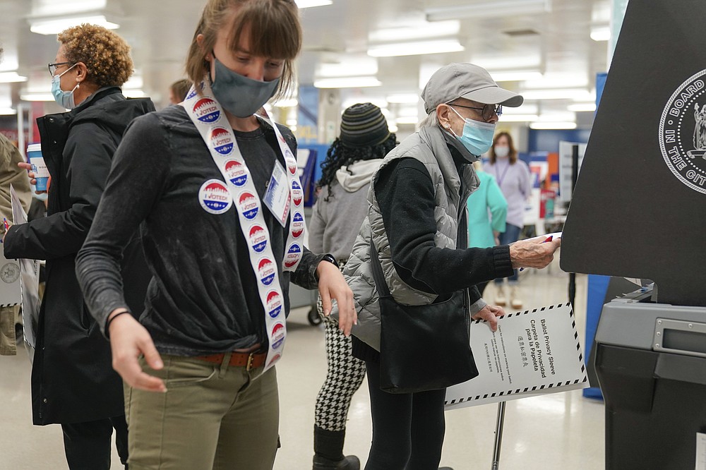 A voter scans their ballot at a polling place in New York, Tuesday, Nov. 2, 2021. (AP Photo/Seth Wenig)