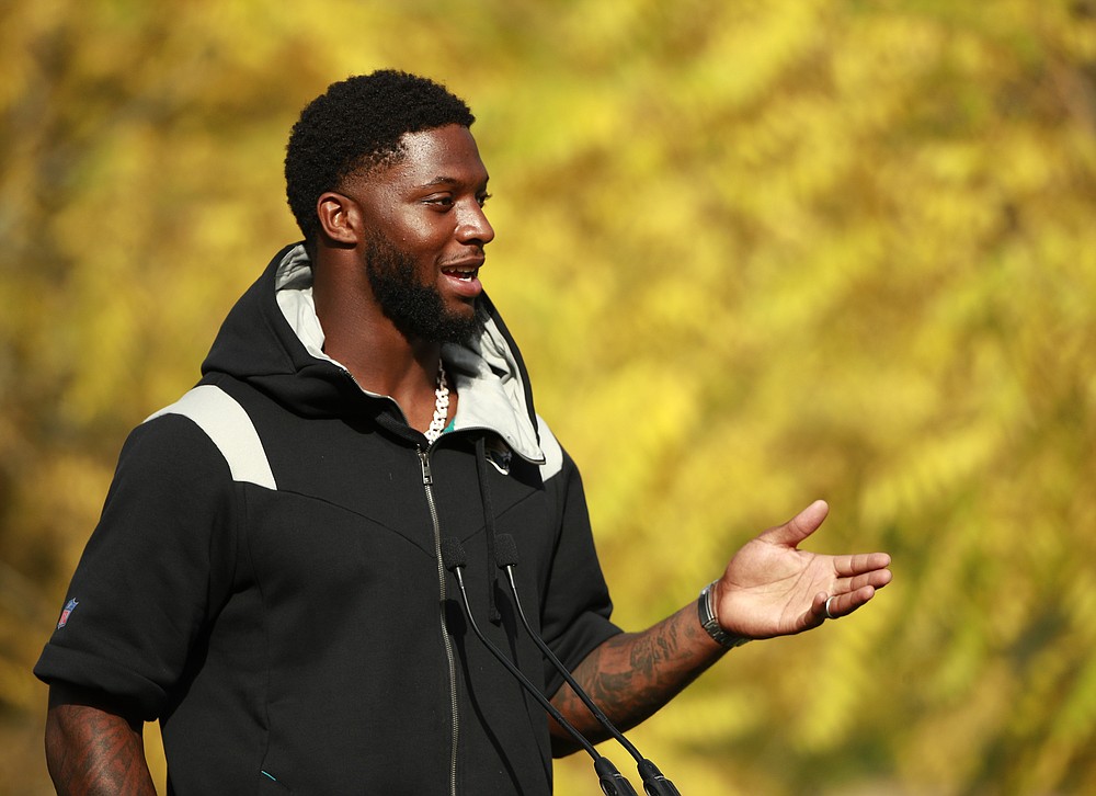Jacksonville Jaguars outside linebacker Josh Allen (41) gestures as he answers a question during a practice and media availability by the Jacksonville Jaguars at Chandlers Cross, England, Friday, Oct. 15, 2021. The Jaguars will plat the Miami Dolphins in London on Sunday. (AP Photo/Ian Walton)
