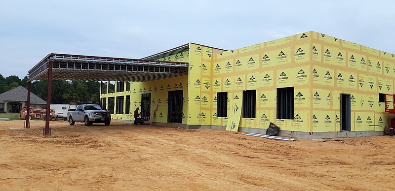 The new location for Pain Treatment Center of America in Texarkana is under construction, across from the coming new Veterans Administration Center. The facility, which will be an expanded version of their current clinic on State Line Avenue, is expected to be ready by summer 2022. (Staff photo by Junius Stone)