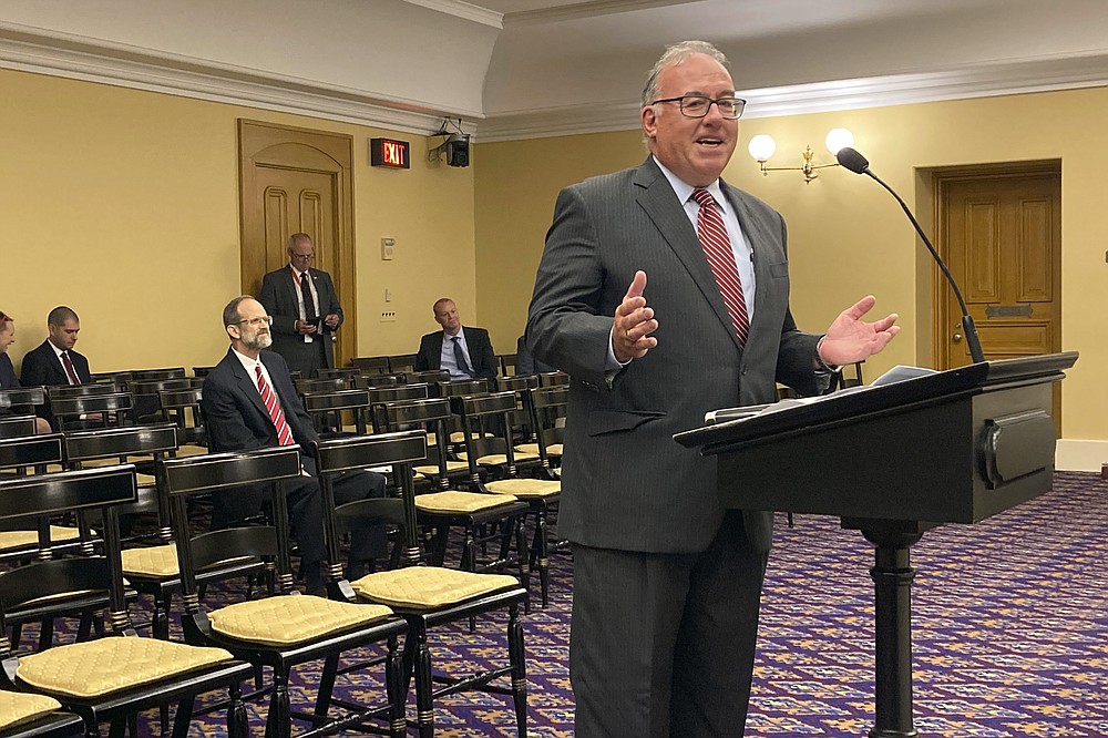 FILE - Ross McGregor, a Springfield factory owner, testifies against a GOP House bill that would put limits on employers' ability to mandate the coronavirus vaccine as a condition of employment, on Wednesday, Oct. 6, 2021, in Columbus, Ohio. McGregor, a former Republican House lawmaker, testified on behalf of the Ohio Manufacturers' Association, and said businesses are in the best position to determine what safety measures they need to set forth. (AP Photo/Andrew Welsh-Huggins, File)