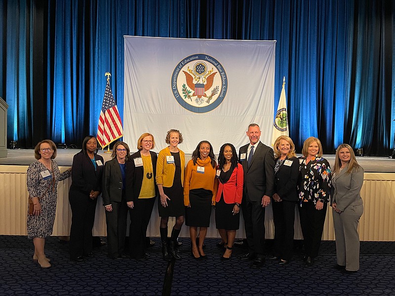 Representatives from the four Arkansas schools that were recognized as Blue Ribbon Schools this year -- Hugh Goodwin Elementary, of El Dorado; Carolyn Lewis Elementary in the Conway Public School District; Park Magnet School in the Hot Springs School District; and Portland Elementary School in the Hamburg School District -- are seen at an awards reception in Washington, D.C. (Courtesy of Raven Swint, El Dorado School District)