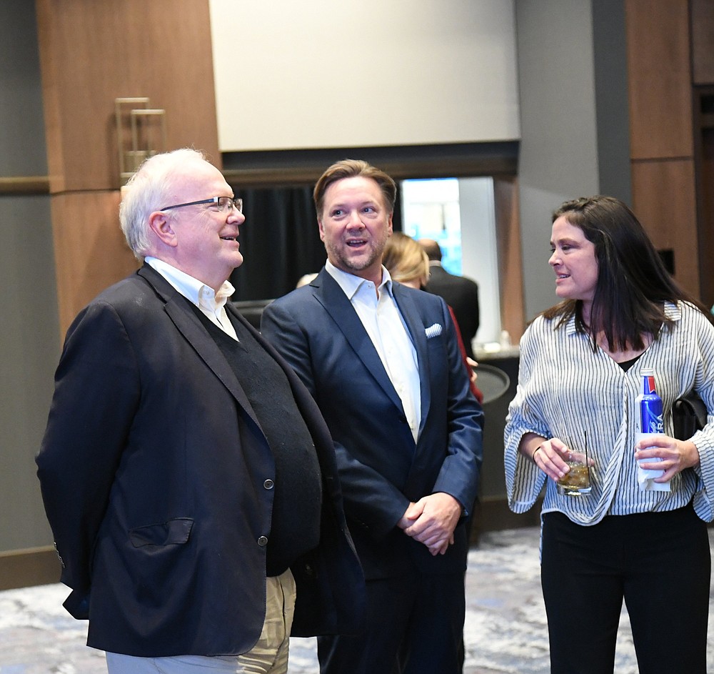Arkansas Democrat-Gazette columnist and Senior Editor Rex Nelson, left, chats with guests prior to the Hot Springs Board of Realtors' 100th Anniversary Celebration at Oaklawn Racing Casino Resort's event center. Nelson was the keynote speaker. - Photo by Tanner Newton of The Sentinel-Record