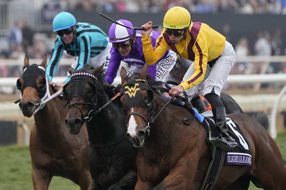 Irad Ortiz Jr., right, rides Twilight Gleaming to win the Breeders' Cup Juvenile Turf Sprint race at the Del Mar racetrack in Del Mar, Calif., Friday, Nov. 5, 2021. (AP Photo/Gregory Bull)