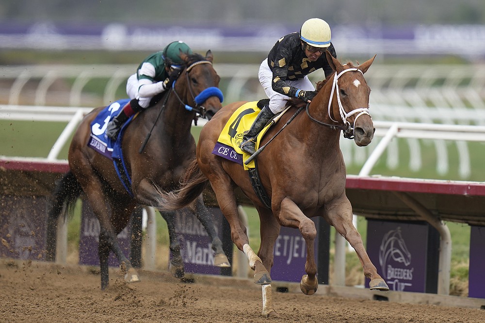 Victor Espinoza rides Ce Ce, right, to victory past Joel Rosario, riding Edgeway, during the Breeders' Cup Filly & Mare Sprint race at Del Mar in Del Mar, Calif., Saturday, Nov. 6, 2021. (AP Photo/Jae C. Hong)