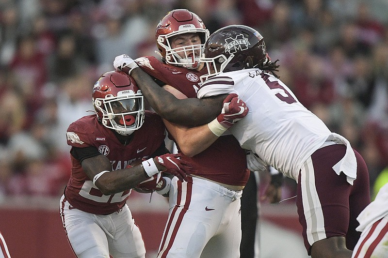 Arkansas running back Trelon Smith (22) carries the ball, Saturday, November 6, 2021 during the fourth quarter of a football game at Reynolds Razorback Stadium in Fayetteville. Check out nwaonline.com/211106Daily/ for today's photo gallery. 
(NWA Democrat-Gazette/Charlie Kaijo)