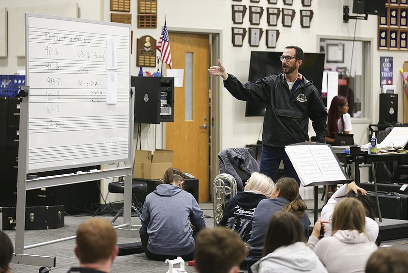 Bentonville Band Director Tim Hendrix gives instructions Oct. 28 at Bentonville High School in Bentonville. The Bentonville band and color guard practiced in preparation to travel to St. Louis for the Bands of America Super Regional and Grand Nationals in Indianapolis. Check out nwaonline.com/211107Daily/ for today's photo gallery. 
(NWA Democrat-Gazette/Charlie Kaijo)