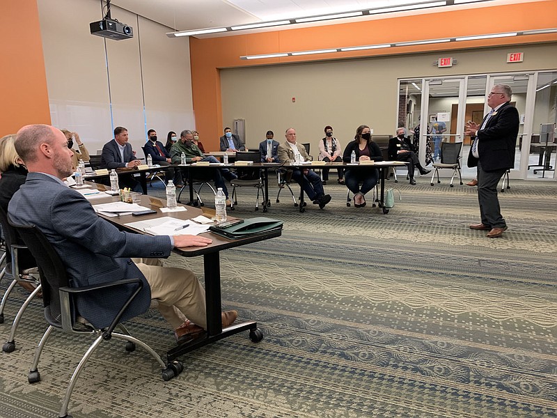 Ricky Tompkins, vice president of learning, addresses the Northwest Arkansas Community College Board of Trustees Monday at the boards' monthly meeting. (NWA Democrat-Gazette/Mary Jordan)