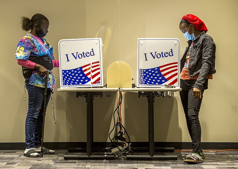 Yolanda Wright, left, and her daughter LaStrease Lewis vote on a 0.5-mill property-tax increase at the Pulaski county regional building in Little Rock on the last day of early voting on Monday, Nov. 8, 2021.


(Arkansas Democrat-Gazette/Stephen Swofford)