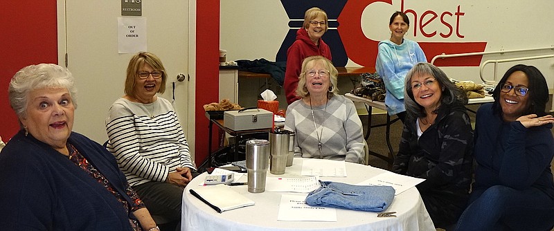 Resting Saturday on the second day of a first garage sale are members of the Atlanta Amity Club. From left, they are Janet Pattillo, Judy Cook, Donna Bird, Nora Pratt, Teri Lovely, Angie Roark and Marie Shelton. The event was a success but required extensive effort, said President Teri Lovely. “Not certain if we’ll do it again,” she said.