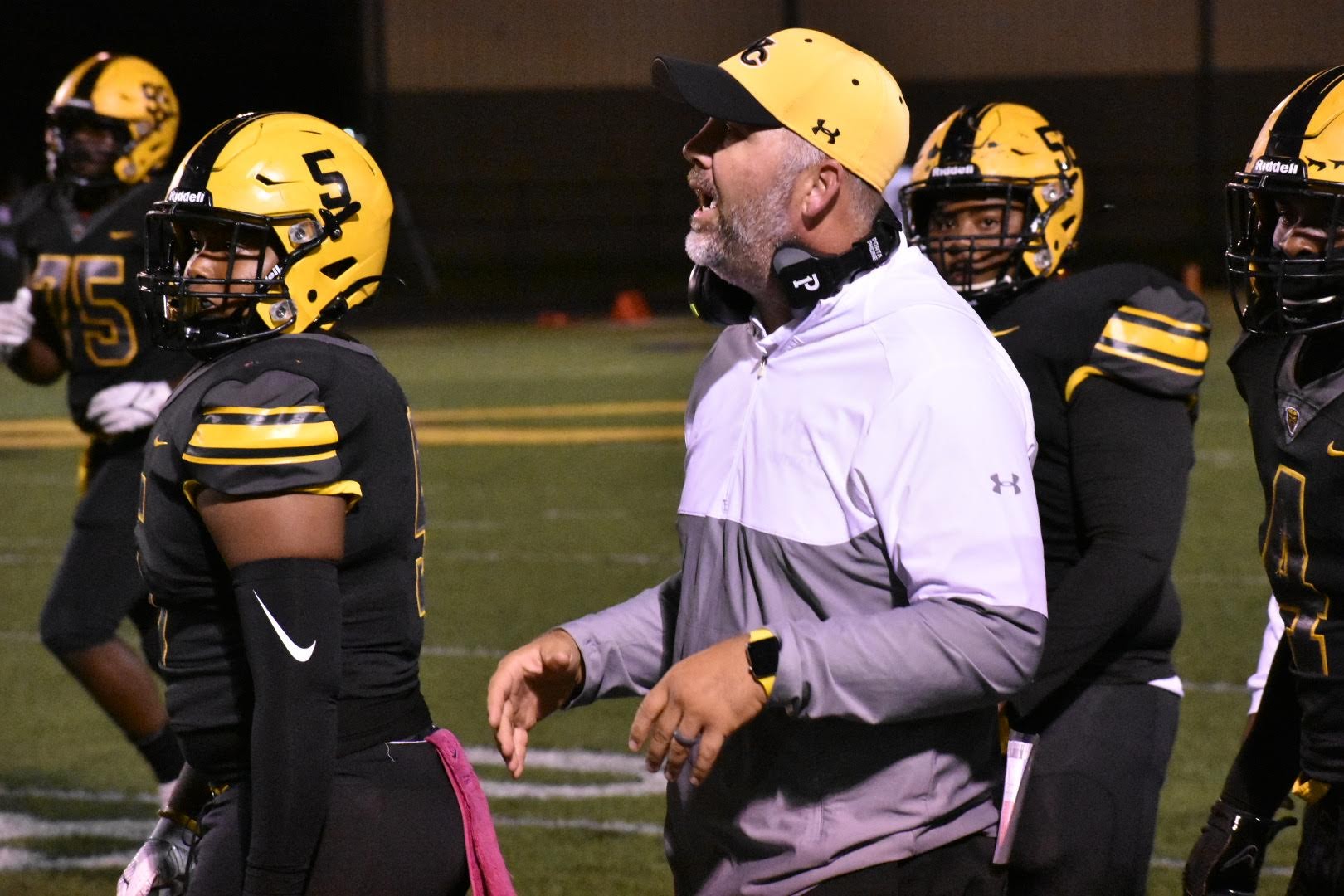 Dutton resigns from football-coach role