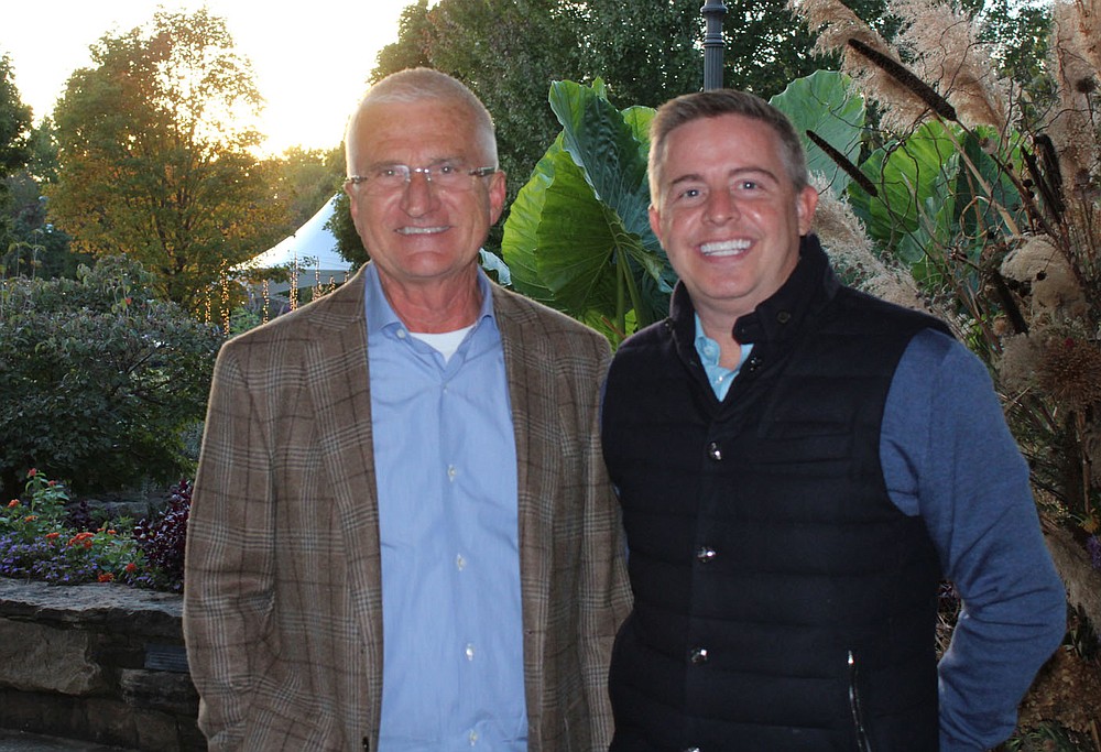 Botanical Garden of the Ozarks Autumn Gala Honorary Chairmen Kirk Thompson (left) and Brett Burch welcome garden backers to the benefit Oct. 21 at the garden in Fayetteville.
(NWA Democrat-Gazette/Carin Schoppmeyer)